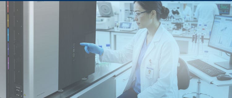 Researcher working with the ID7000 Spectral Cell Analyzer in a lab setting.