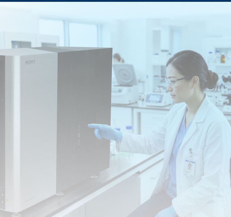 Researcher working with the ID7000 Spectral Cell Analyzer in a lab setting.